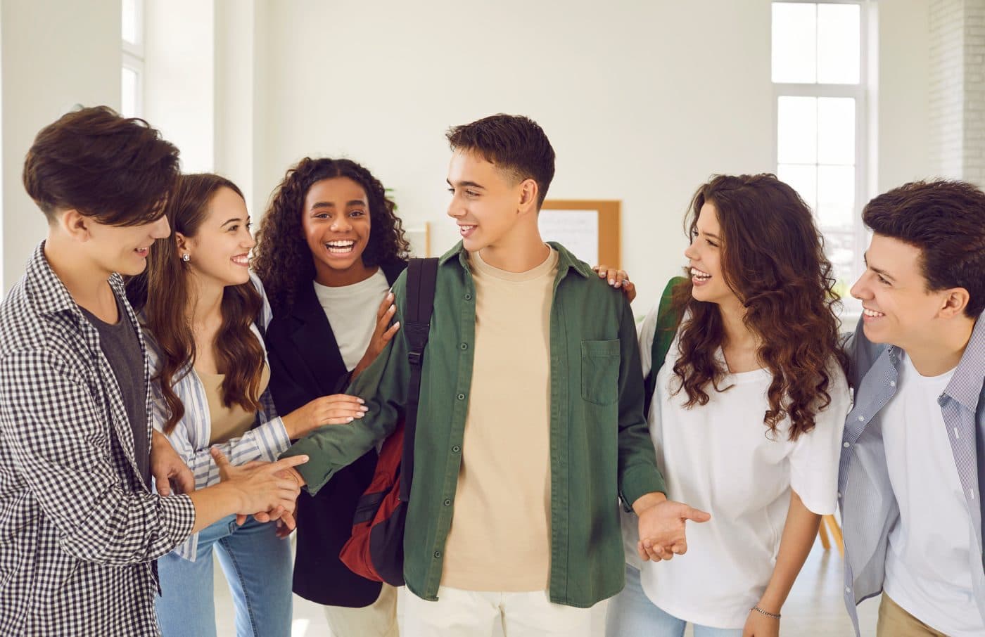 A group of students laughing together at school